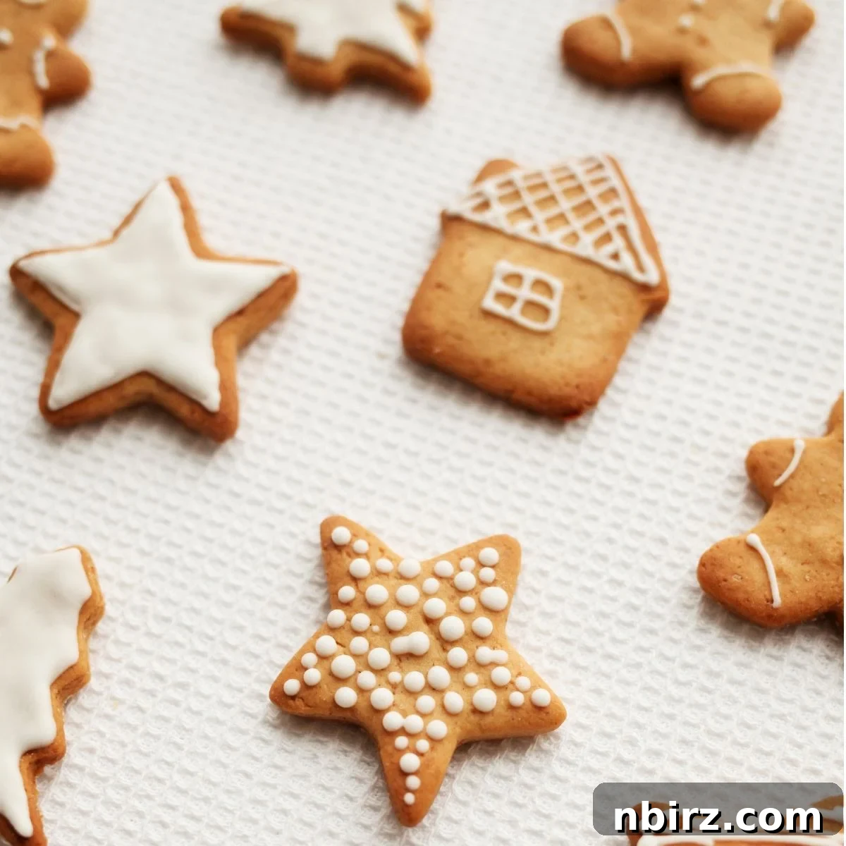 Wholesome Vegan Oat Flour Cutouts 3 oat flour sugar cookie cut outs on a piece of white parchment paper