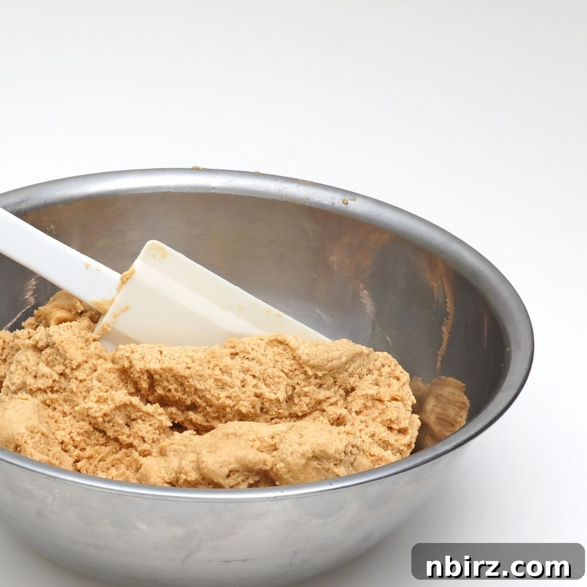 Wholesome Vegan Oat Flour Cutouts 4 stainless steel bowl full of oat flour cut out cookie dough