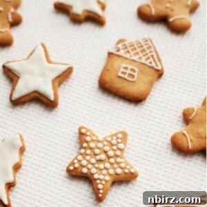 oat flour sugar cookie cut outs on a piece of white parchment paper