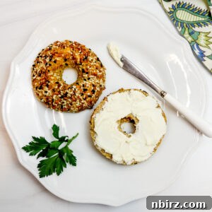 white bean bagels on a white plate with cream cheese