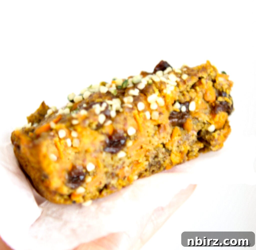 Delightful Vegan Carrot Cake Breakfast Cookies Gluten Free Oil Free 5 Half of a vegan carrot cake breakfast cookie, revealing its moist interior with visible carrot shreds