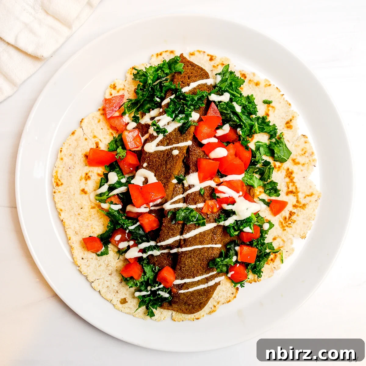 Power-Packed Lentil Gyros Soy-Free Goodness 4 An appetizing open-faced lentil gyro, richly garnished with fresh vegetables and creamy sauce.