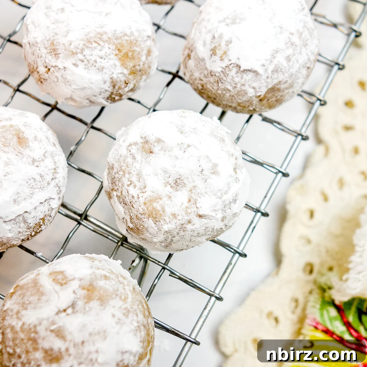 The Perfect Grain-Free Vegan Wedding Cookie 2 Vegan coconut flour wedding cookies on a cooling rack