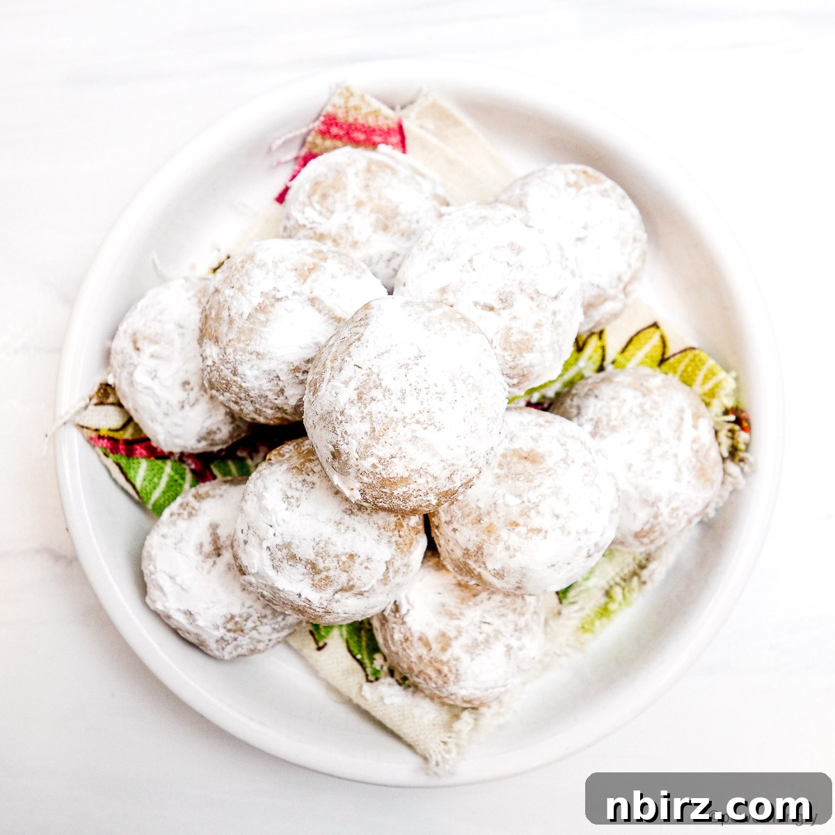 The Perfect Grain-Free Vegan Wedding Cookie 8 White plate piled with vegan wedding cookies