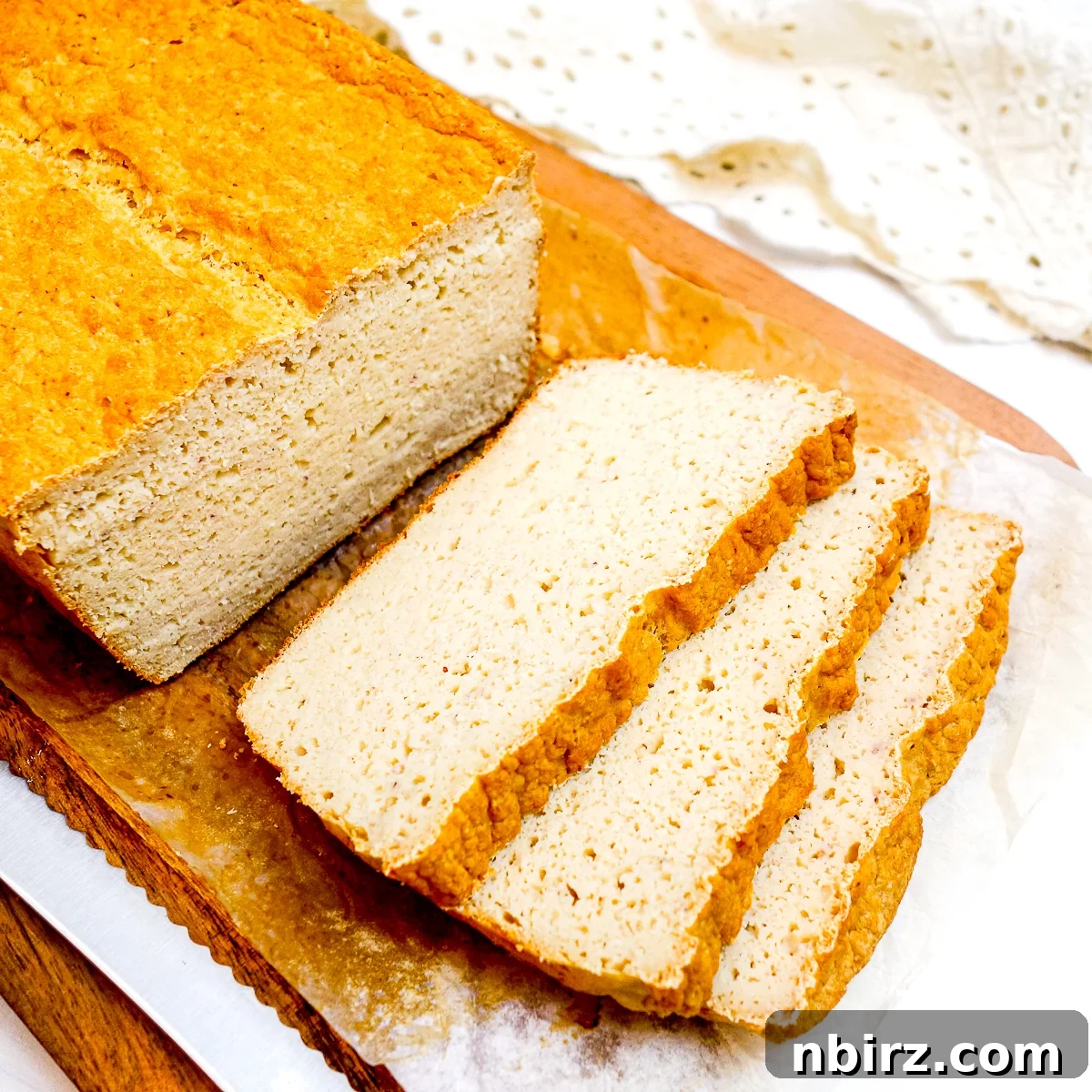 Protein-Packed Bean and Millet Bread Oil-Free Vegan Gluten-Free 5 millet bread with protein on a cutting board