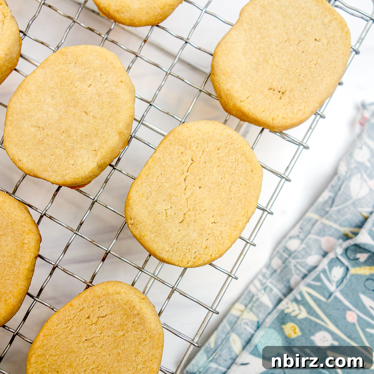 Heavenly Vegan Grain Free Cassava Shortbread Cookies 10 Delicate shortbread cookies cooling on a wire rack on a kitchen counter, allowing them to fully crisp up and set.