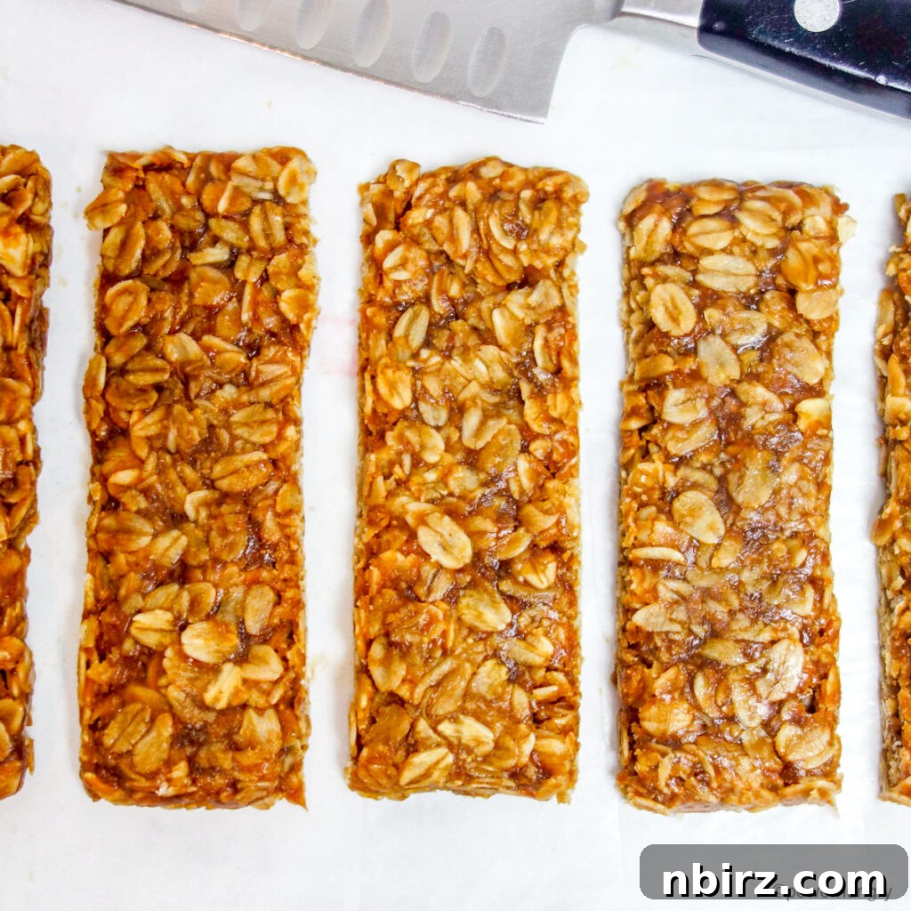 3-ingredient no-bake granola bars, cut on a piece of white parchment paper