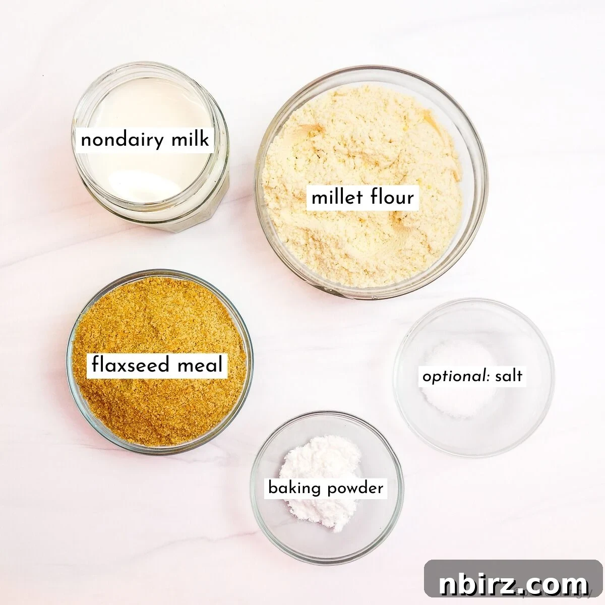 Effortless 4-Ingredient Millet Biscuits: Gluten-Free & Vegan Delight 4 The four key ingredients for easy millet biscuits, beautifully displayed in glass bowls.