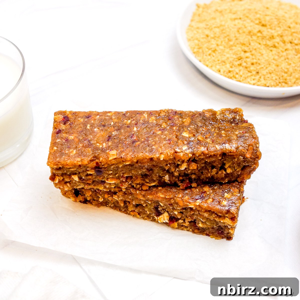 A stack of golden flax protein bars, showcasing their wholesome texture and inviting appearance.