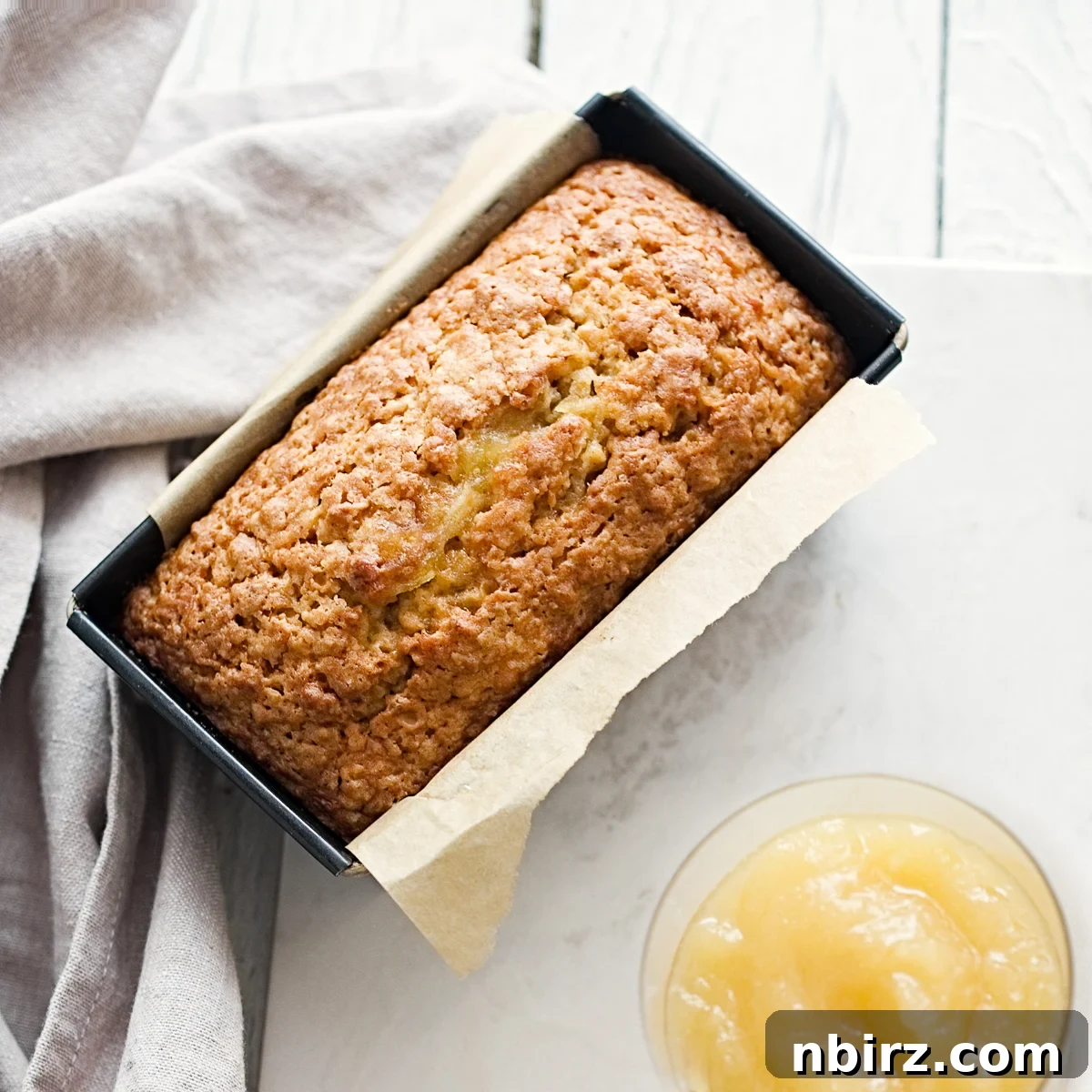 Healthy Oil Free Gluten Free Applesauce Oatmeal Bread 2 Delicious vegan oat flour applesauce bread in a loaf tin, perfectly baked
