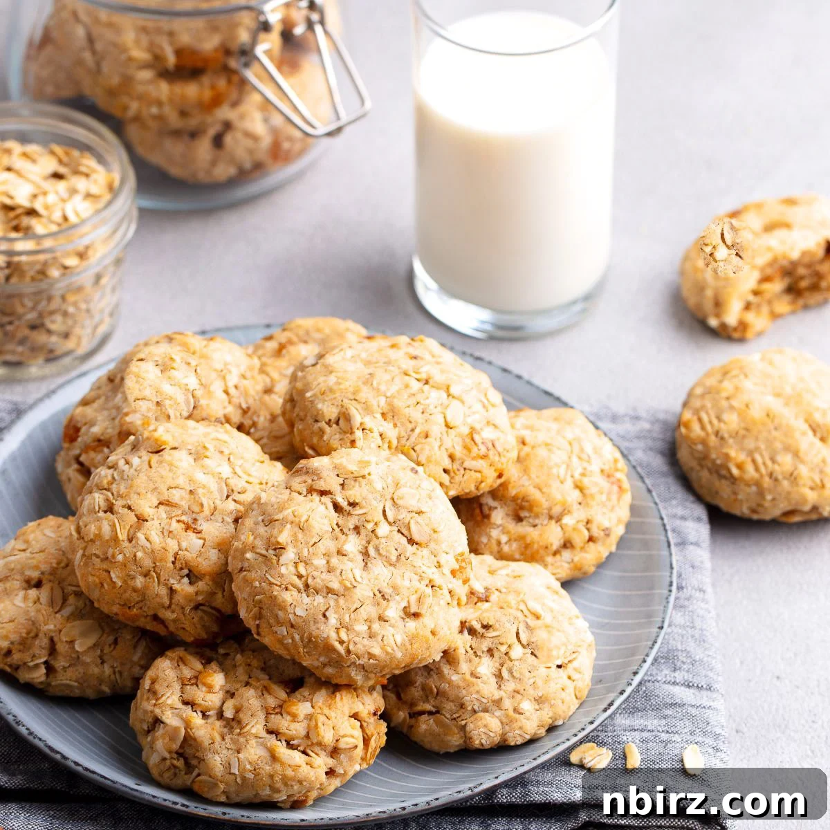 No-Fuss Almond Butter Oat Cookies 8 A plate of almond butter oat flour cookies with a glass of milk in the background