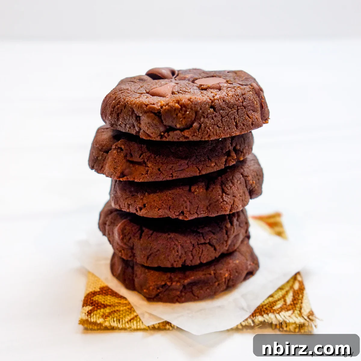 Decadent Vegan Gluten Free Chocolate Peanut Butter Chickpea Cookies 3 A perfectly stacked pile of five chocolate peanut butter chickpea flour cookies