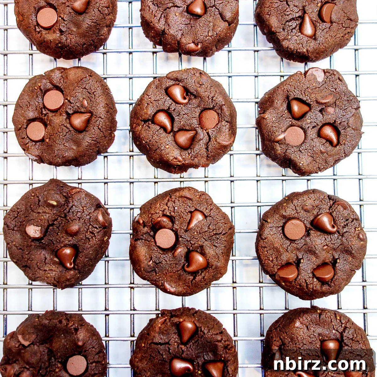 Decadent Vegan Gluten Free Chocolate Peanut Butter Chickpea Cookies 9 Chocolate cookies cooling on a metal wire cooling rack