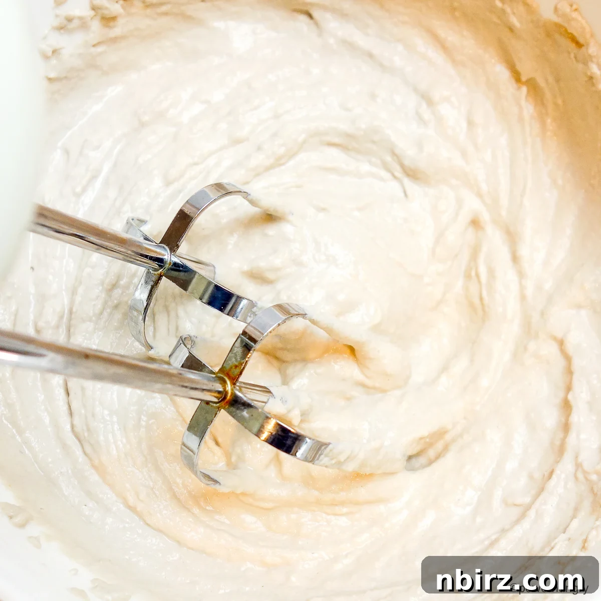 Velvety Sunflower Whipped Cream Cashew and Coconut Free 2 sunflower seed whipping cream getting beaten with electric beaters to achieve fluffy texture