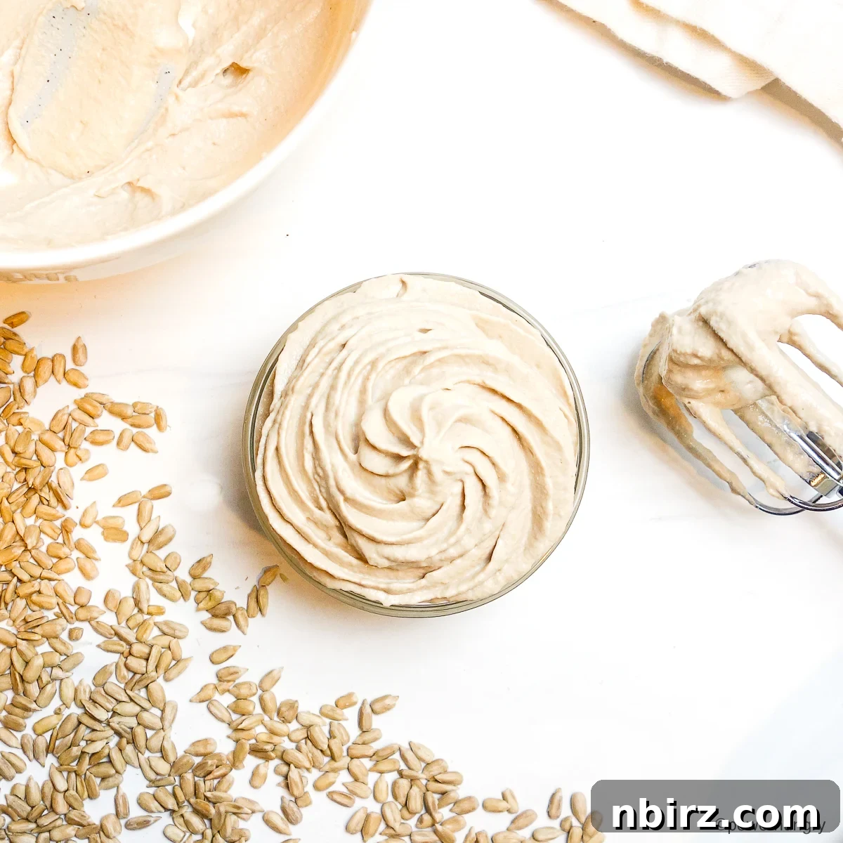 Velvety Sunflower Whipped Cream Cashew and Coconut Free 3 sunflower seed whipped cream in a glass bowl, perfectly whipped and ready to be used