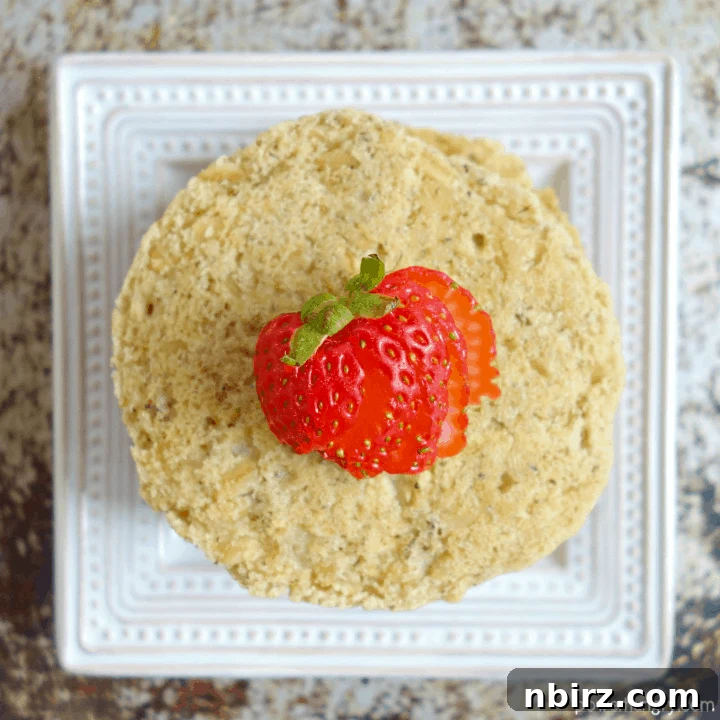 Fluffy Vegan Oat Pancakes (Gluten & Banana-Free) 3 Overhead shot of vegan oat pancakes with a strawberry