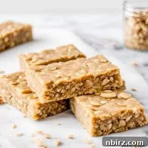 Wholesome Four-Ingredient Vegan No-Bake Cookie Dough Protein Bars 4 stack of oat protein bars on white marble board