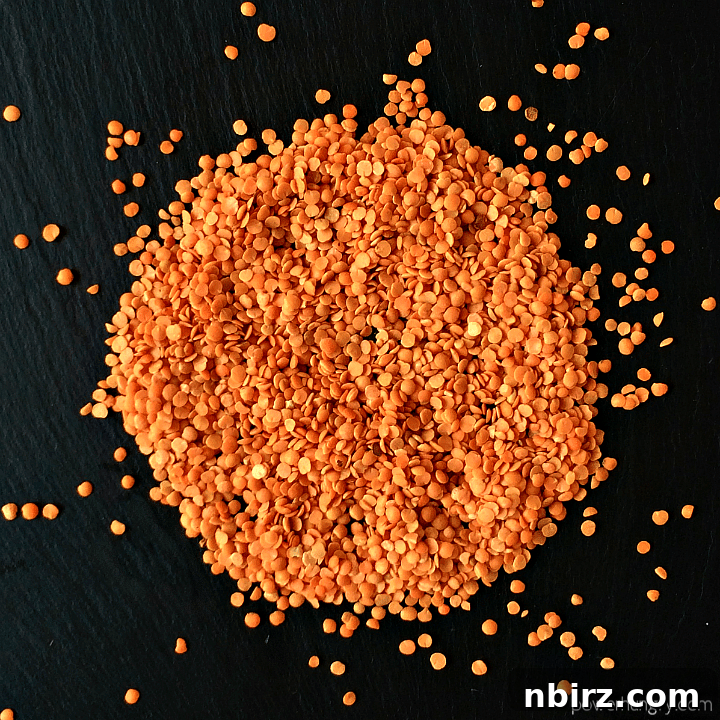 Creamy Vegan Red Lentil Protein Dip 3 A pile of red lentils on a piece of slate