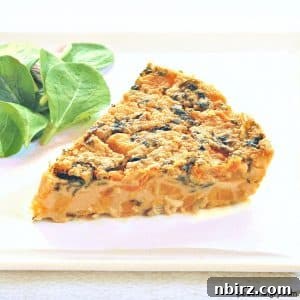 slice of sweet potato kale chickpea flour frittata on a white plate