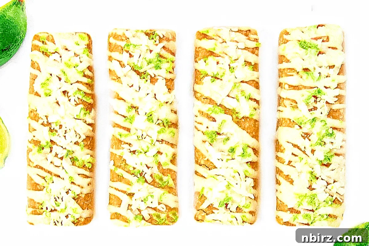 Pure Plant-Powered Coconut Lime Protein Bars 4 Close-up of a row of perfectly formed coconut lime protein bars, highlighting their smooth texture.