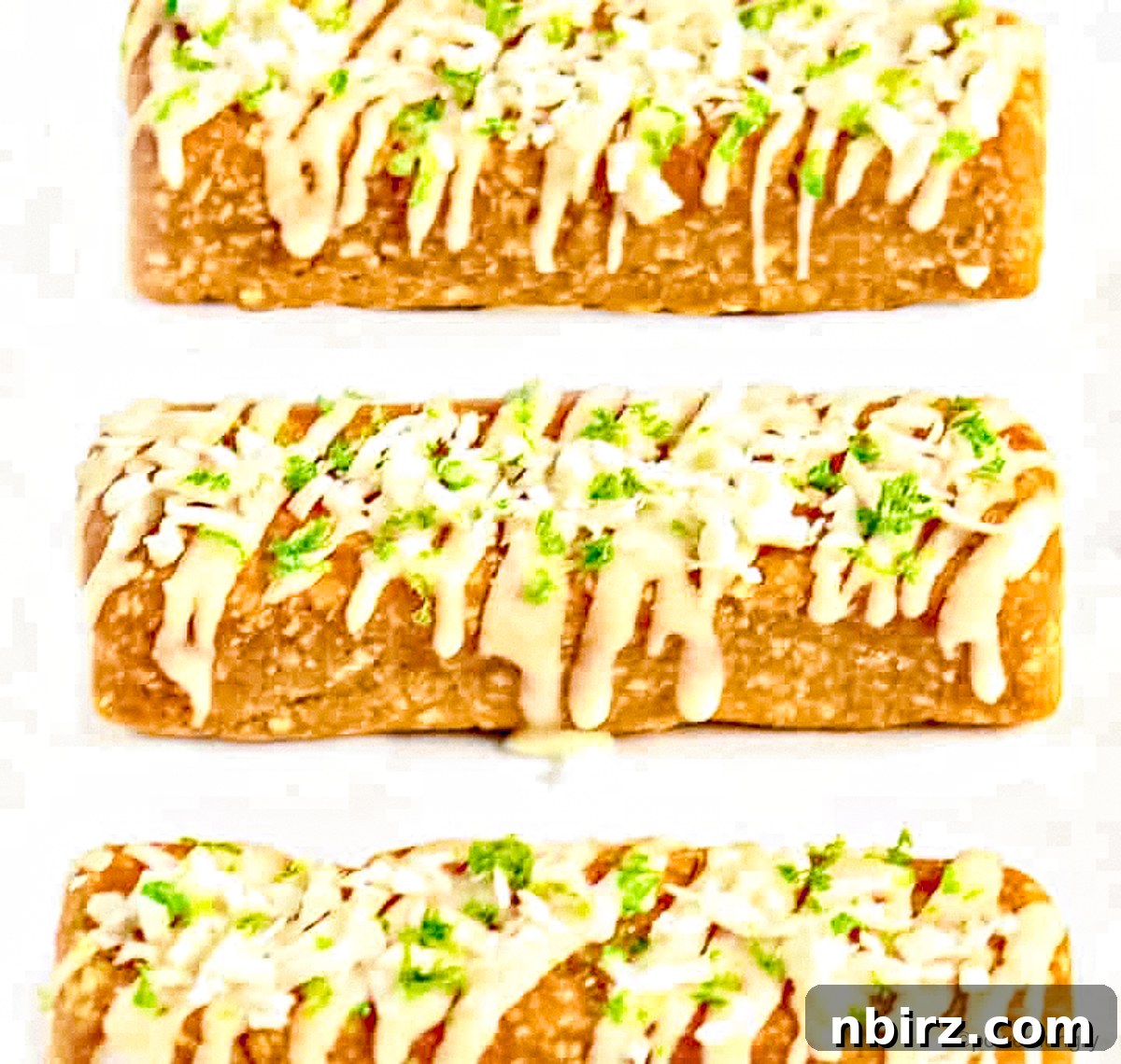 Pure Plant-Powered Coconut Lime Protein Bars 5 Appetizing coconut and lime protein bars arranged on a white plate, highlighting their snack appeal.