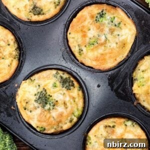 chickpea flour broccoli muffins in a dark muffin tin