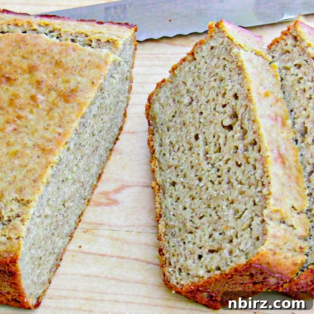 Vegan Gluten Free Quinoa Flour Banana Bread 4 slices of quinoa banana bread on a light wood cutting board