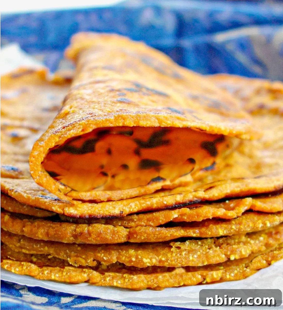 Effortless 3 Ingredient Gluten Free Sweet Potato Tortillas 8 A rolled vegan sweet potato tortilla, showcasing its pliability and ready for filling.