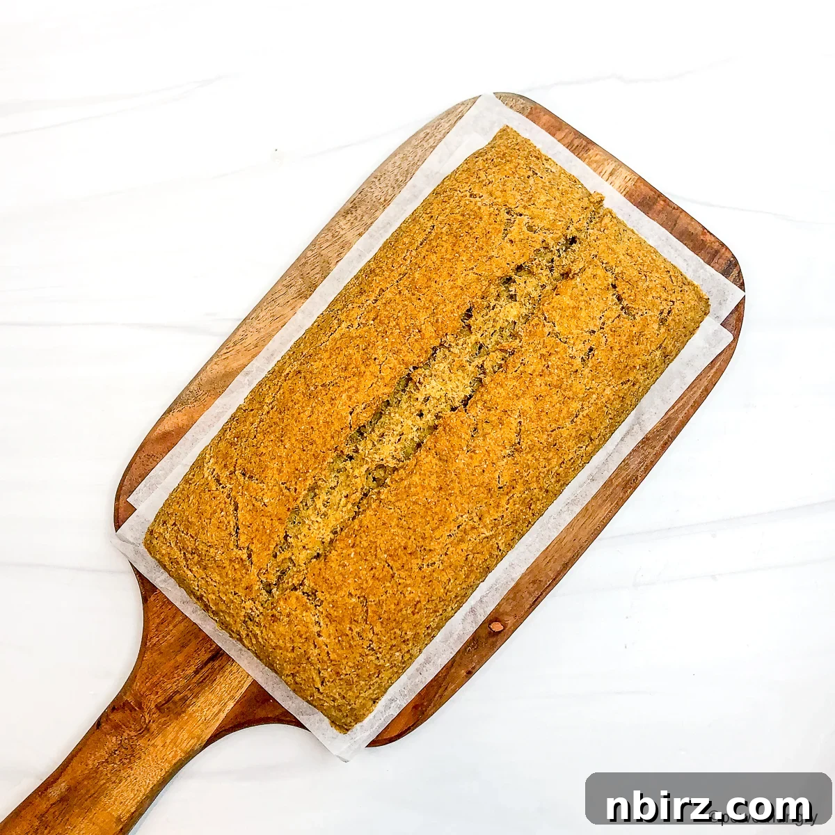 High-Protein Chickpea Bread 3 Overhead view of high-protein bread on a wooden cutting board