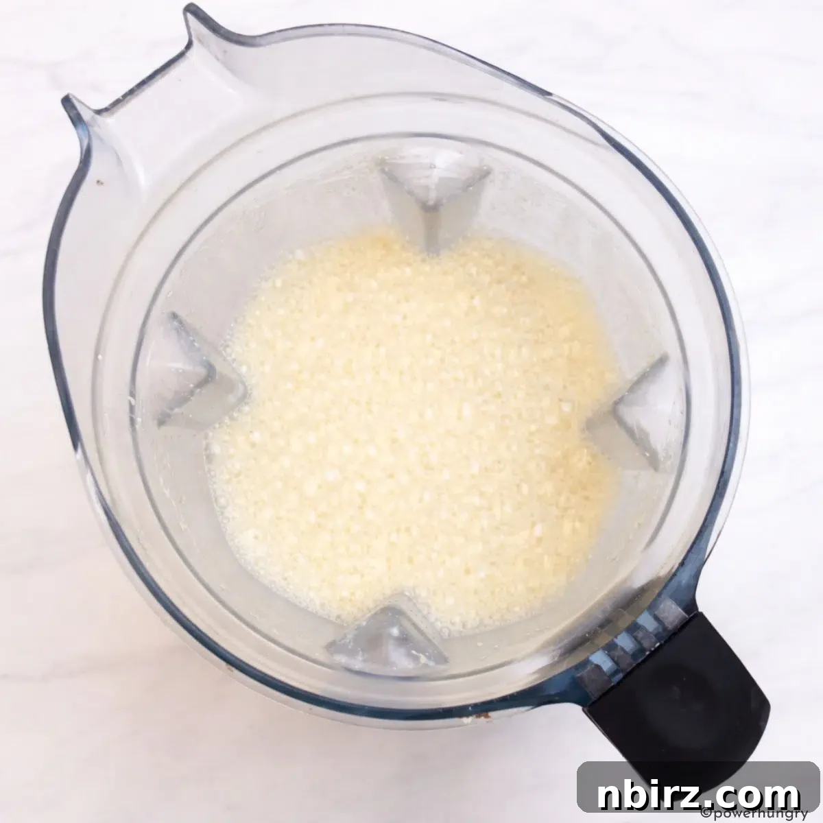 blender with the wet ingredients for high protein millet bread