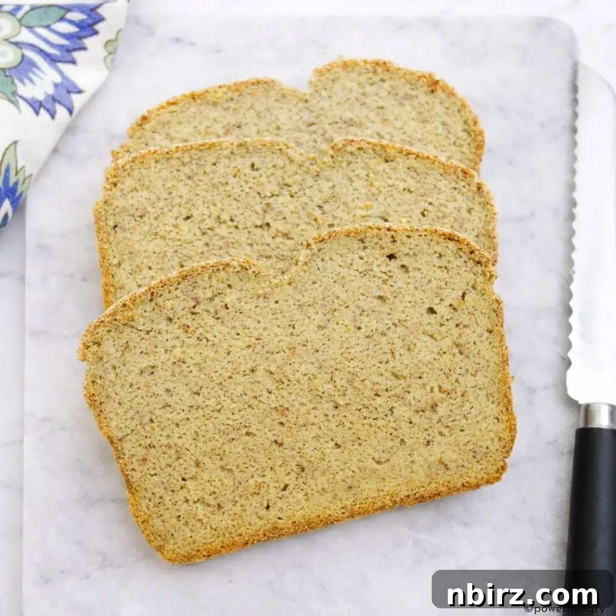 slices of high protein millet bread on cutting board