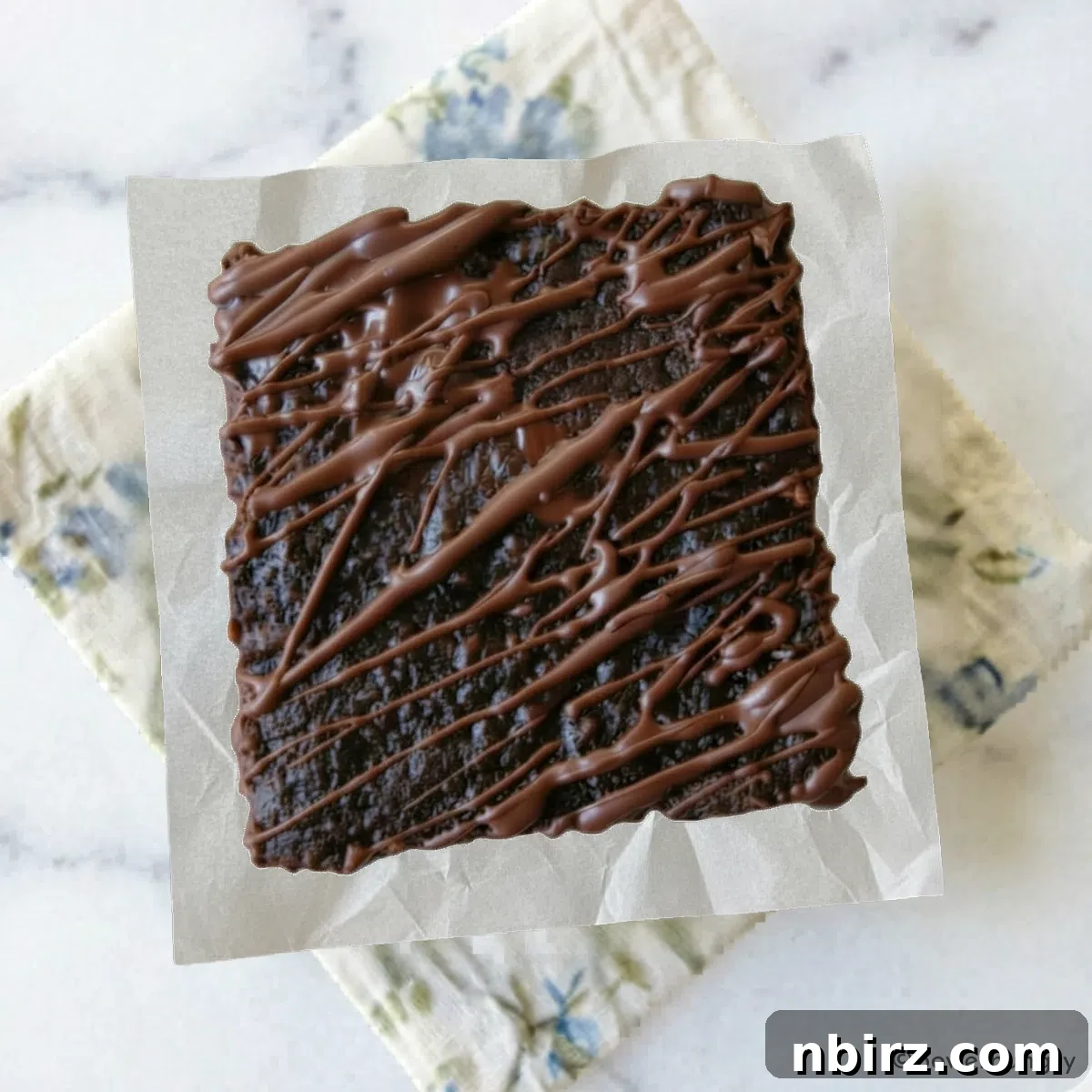 Decadent Grain-Free Vegan Carob Almond Brownies 3 Overhead shot of a single perfectly sliced vegan carob almond flour brownie, showcasing its dense, fudgy interior.