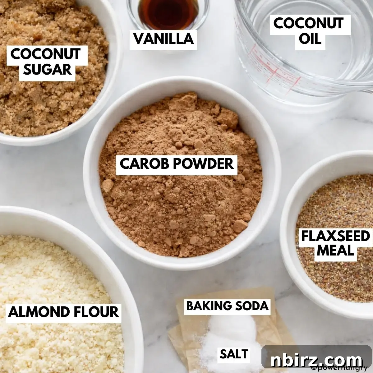 Decadent Grain-Free Vegan Carob Almond Brownies 4 Arrangement of key ingredients for vegan carob brownies, including carob powder, almond flour, and coconut sugar.