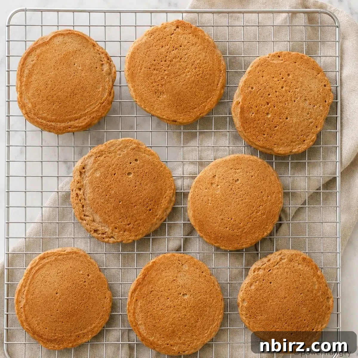 Fluffy Gluten-Free Vegan Buckwheat Pancakes 6 eight vegan buckwheat pancakes on a silver cooling rack